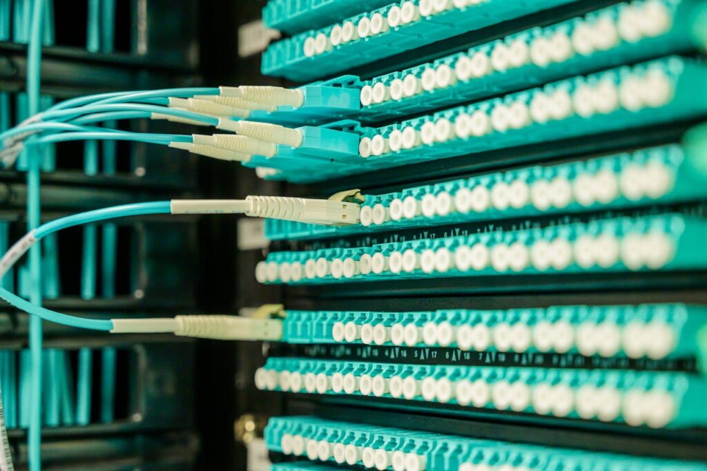pexels photo 2425567 Networking cables plugged into a patch panel, showcasing data center connectivity.